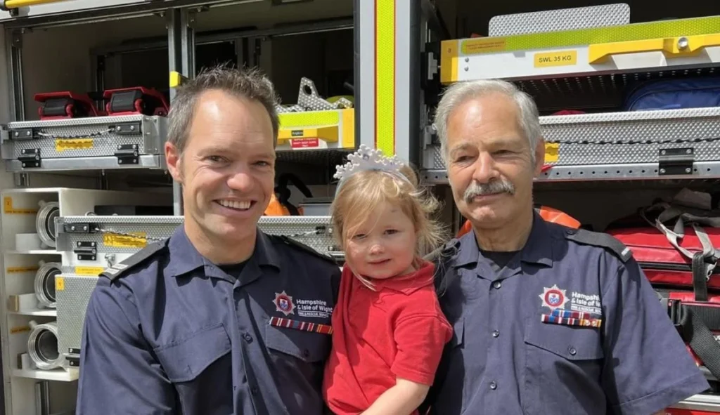 Brian Cole with his firefighter son Neil and granddaughter
