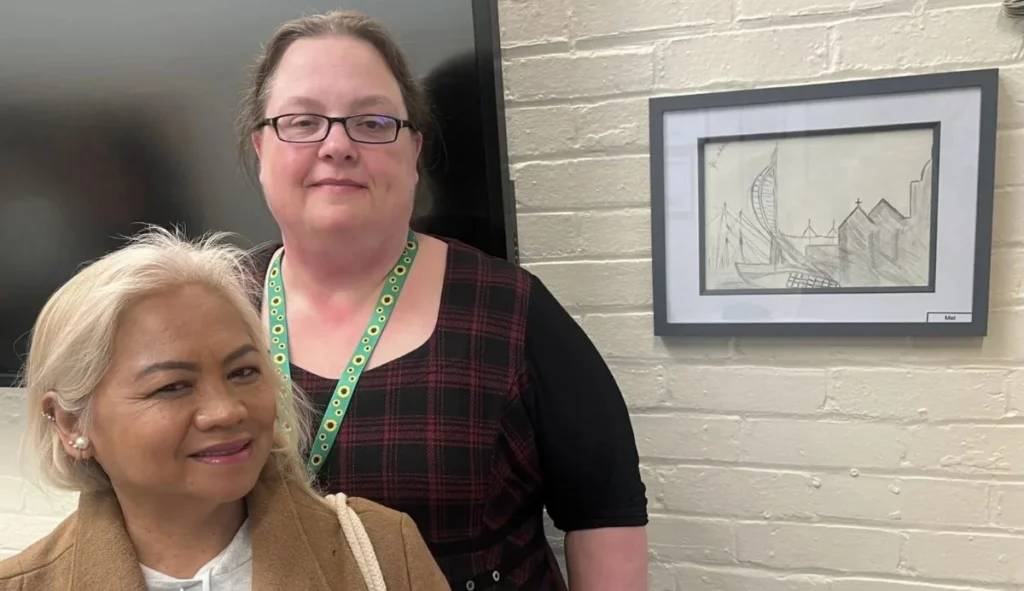 Mel with her artwork and session coordinator Laura